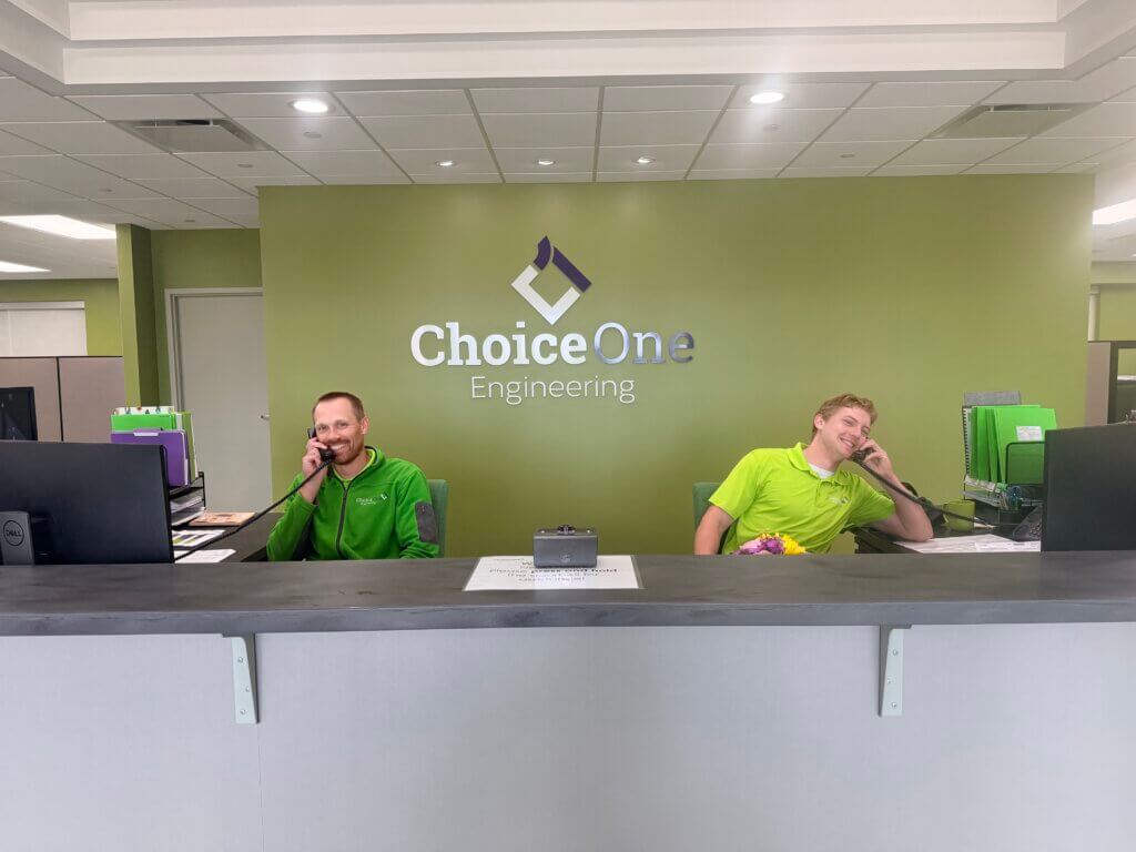 Two Choice One engineers covering front desk duties.